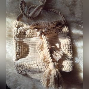 Woven drawstring bucket crossbody bag